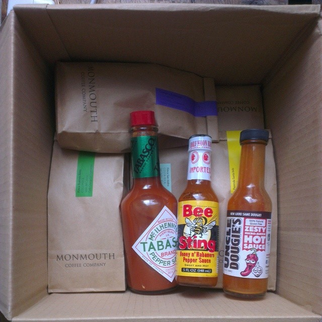 Packing for my surfing holiday: a box of coffee and chili sauces.